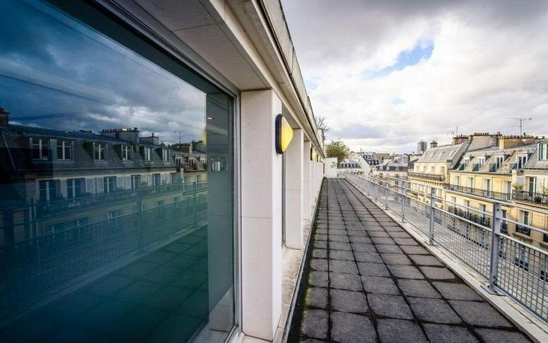 Building terrace at 15, rue Beaujon, Paris, Paris Ile de France with city views.