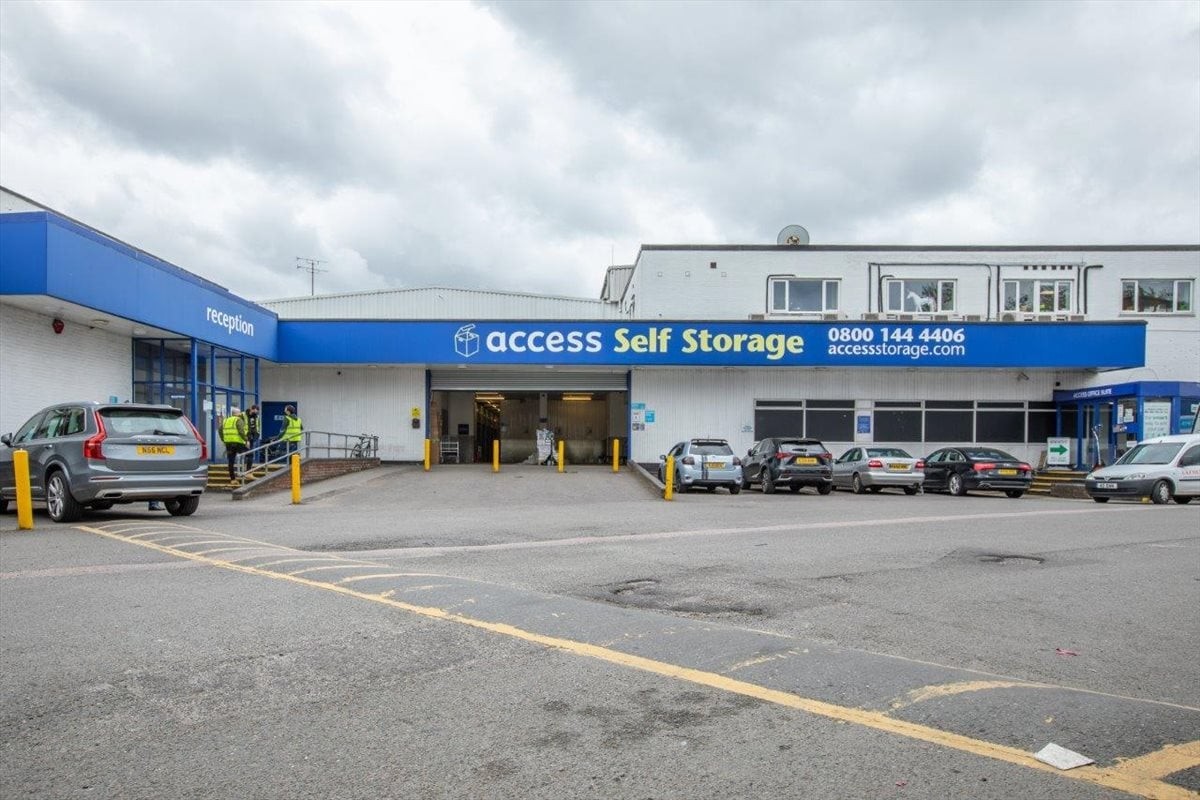 Exterior view of Access Self Storage at 15 Tottenham Lane with parking and building entrance.