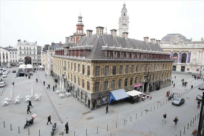 Exterior view of the historic grand building at 16, Place du Général de Gaulle overlooking the city square.