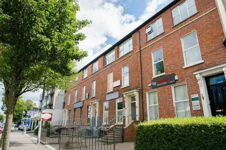 Exterior street view of the brick facade at 180-186 Lisburn Road, Belfast.