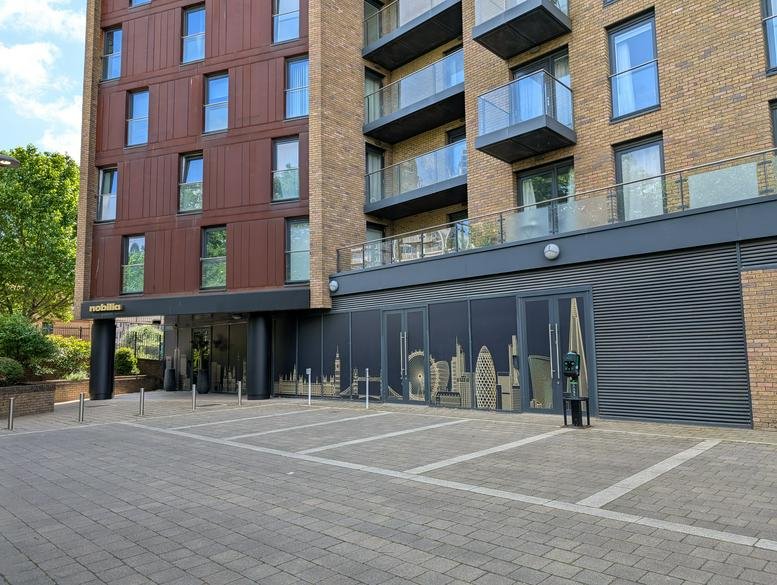 Exterior view of the brick and metal facade of Marine Wharf, 180 Plough Way.