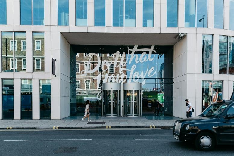 Exterior view of the modern glass entrance at 2 Eastbourne Terrace, Paddington.