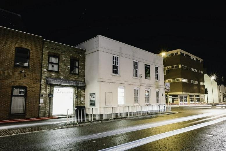 Exterior view of the historic white and brick facade at 2 Huntingdon Street, St. Neots.