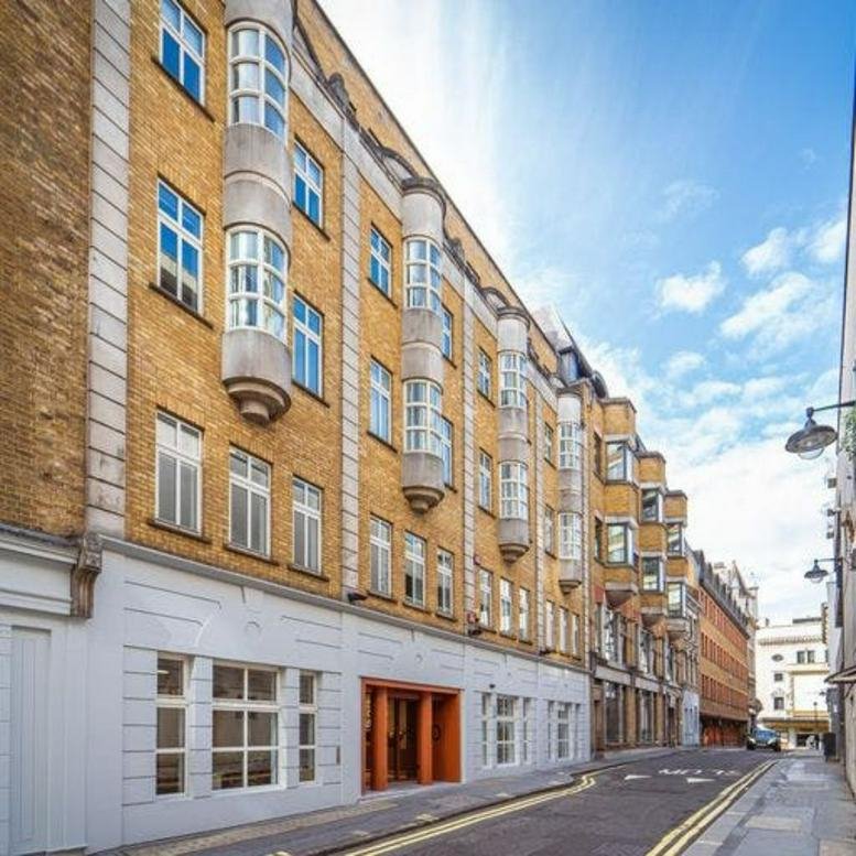 Full exterior facade of the yellow brick building at 20 Orange Street, Covent Garden.
