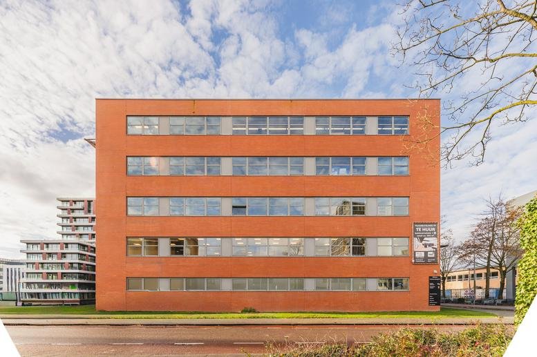 Exterior view of the orange brick facade at 20 Paasheuvelweg, Amsterdam Life Science District.