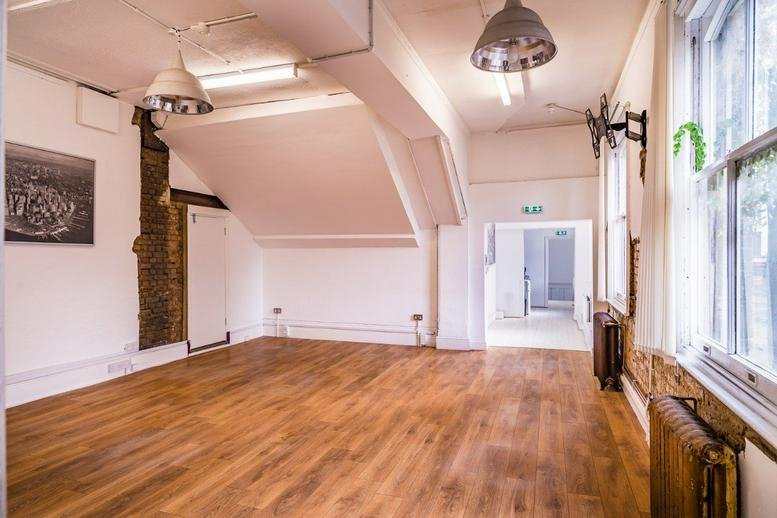 Spacious open-plan office at 21 Bonny Street featuring warm wood floors and abundant natural light.