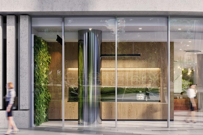 Street-level entrance of the glass-facade building at 21 K. Valdemara Street.