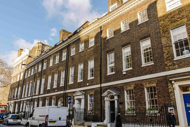Exterior view of the historic brick facade of 23 Southampton Place with classic sash windows.
