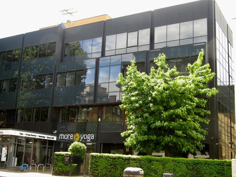 Exterior view of the black glass-facade building at 231 Vauxhall Bridge Road.
