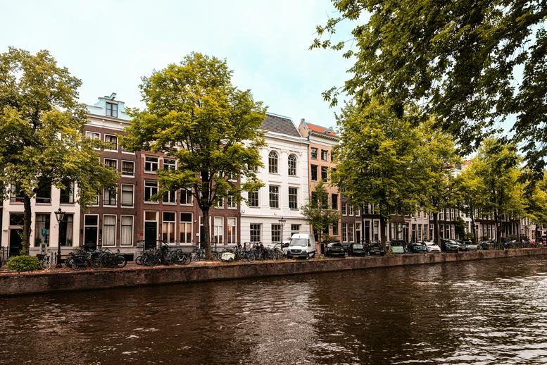 Canal view of historic buildings from the street.