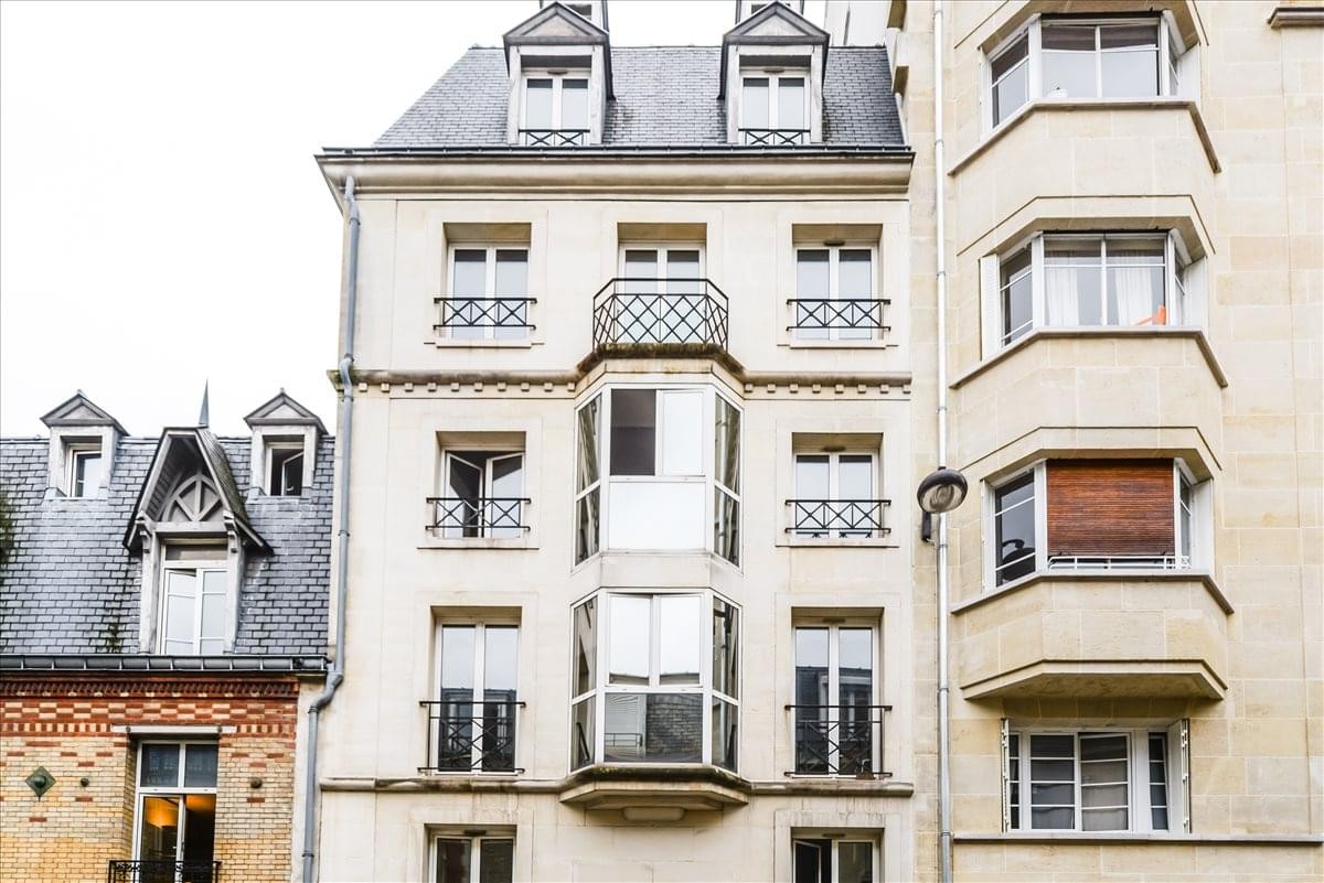 Classic stone facade exterior of the 27/29 Rue Raffet, Paris Ile de France building.