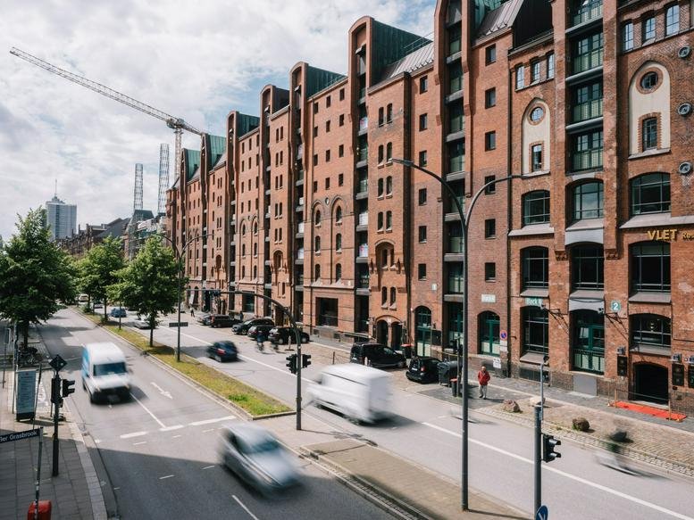 Exterior view of the historic red brick Speicher M27 building on the canal at Am Sandtorkai 27.