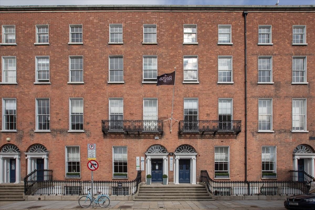 Exterior red brick facade of 28-32 Upper Pembroke Street, Dublin, Ireland.