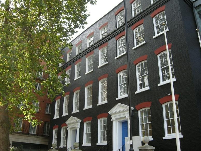 Exterior view of the black period facade at 28 Queen Street, London, EC4R.