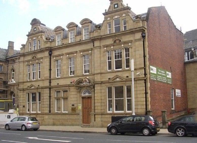 The classic stone exterior of 29 Manor Row, Bradford, showing its grand traditional architecture.