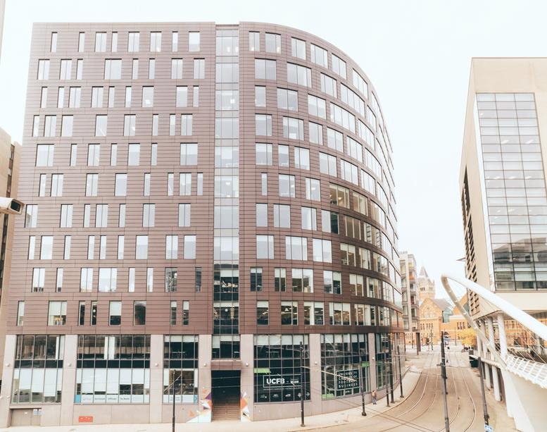 Exterior view of the contemporary brown-brick facade of 3 Piccadilly Place.