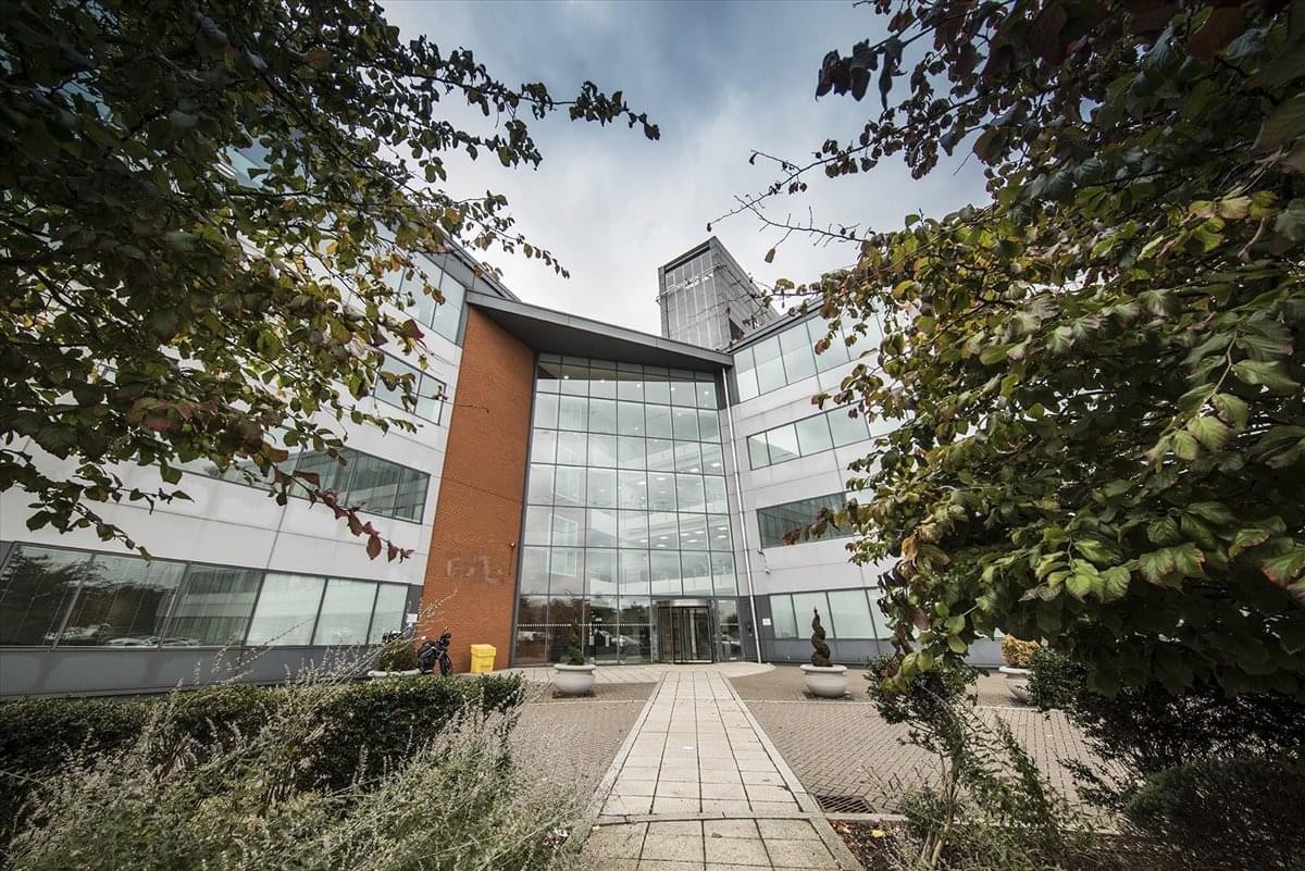 Exterior view of the contemporary glass and brick facade at 3065 Admirals Park, Victory Way.