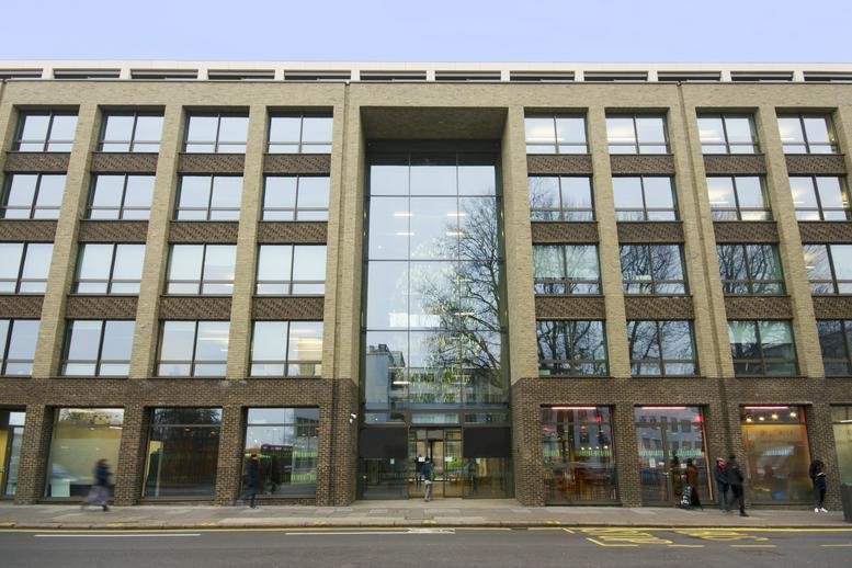 Exterior view of the stone and glass facade of 332 Ladbroke Grove.