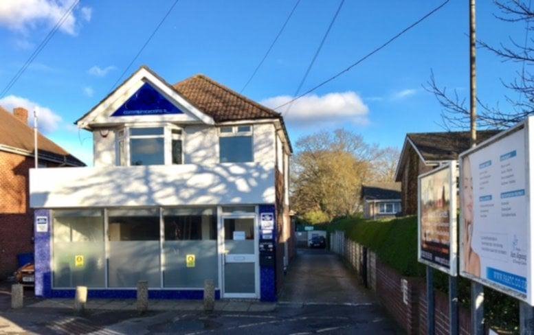 Exterior view of the white and blue two-story building at 389 Ringwood Road.