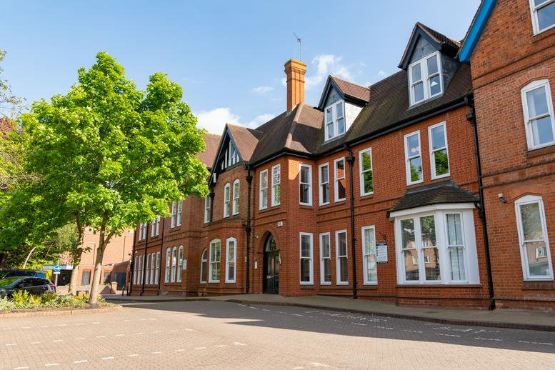 Exterior view of the red brick Victorian-style facade at Dominion, 39-43 Station Road, Solihull Town Centre.