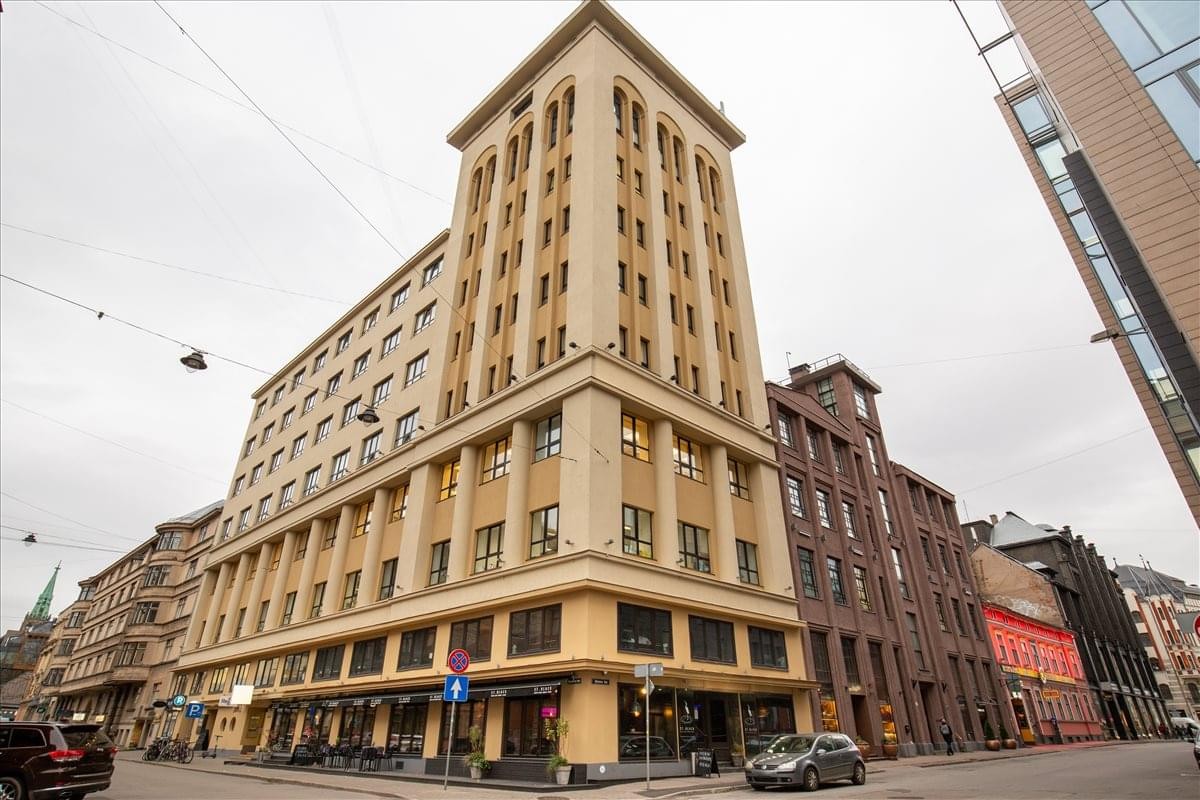 Classic architectural exterior view of Dzirnavu iela 57a with its prominent corner tower.