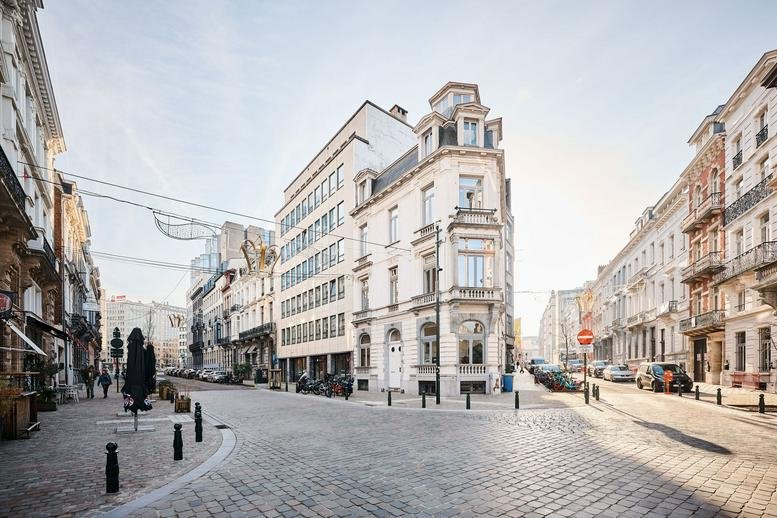 Corner view of the historic building at 4 Rue de la Presse, Central Business District, Brussels.