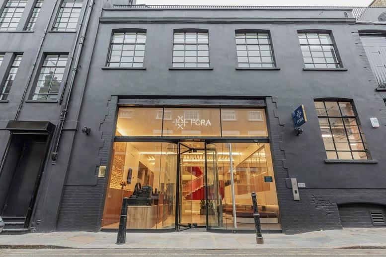 Exterior view of the dark grey brick facade and glass entrance at 42–46 Princelet Street.