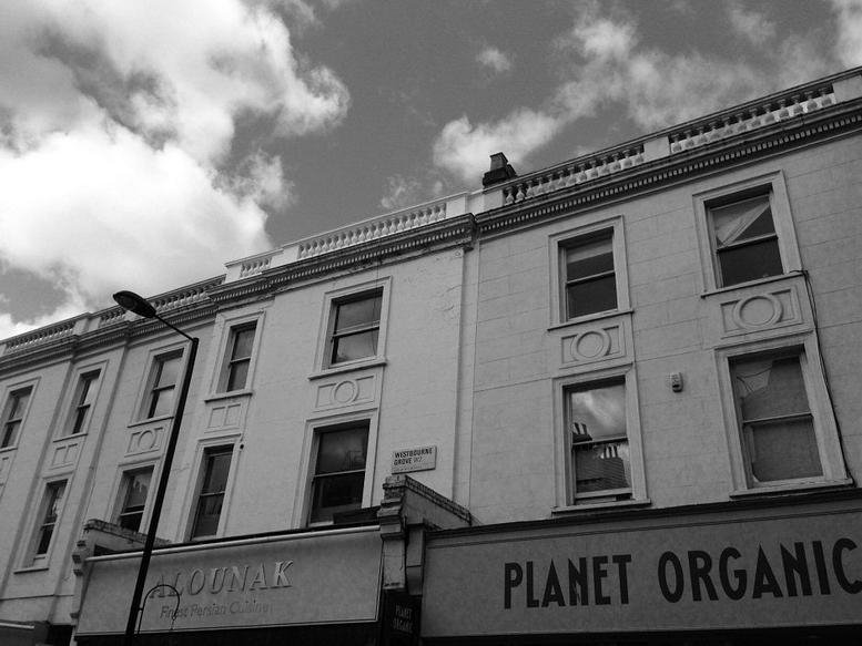 Exterior view of the white period building facade at 42 Westbourne Grove, 2nd Floor, Notting Hill, London, W2, UK.