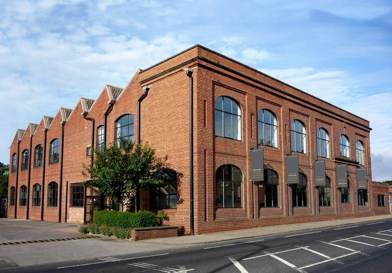 Exterior view of the historic brick industrial facade at 423 Kirkstall Road.