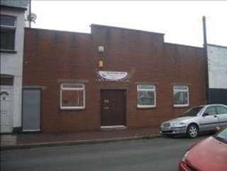 Exterior view of the red brick building at 44 Argyle Street, Newport, Wales.