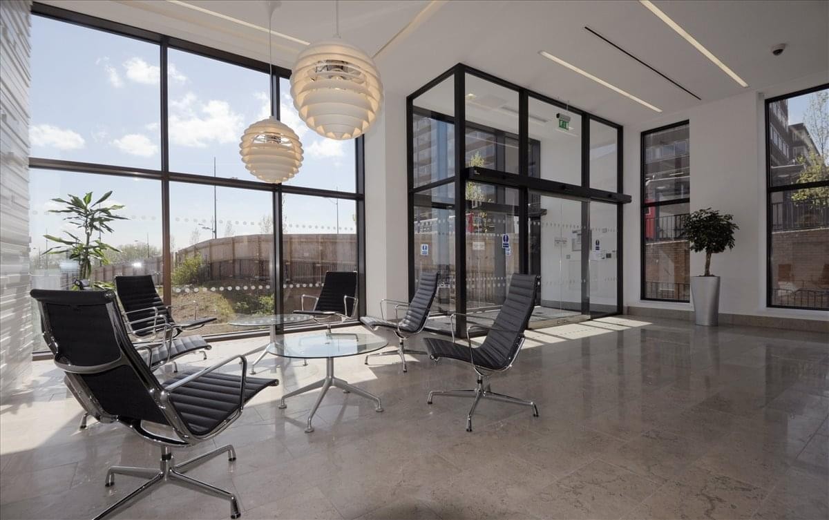 Bright reception area with polished floors and floor-to-ceiling windows.