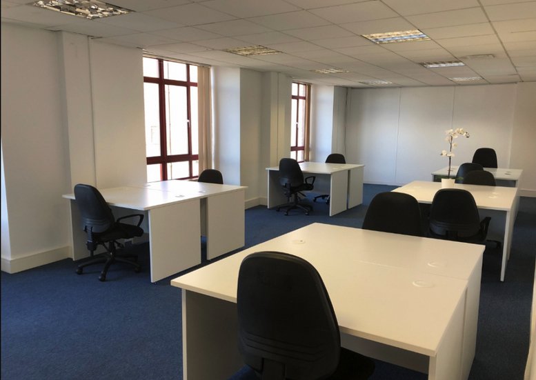 Spacious open-plan workspace at Uxbridge House, 460/466 Uxbridge Road with multiple desks and natural light.