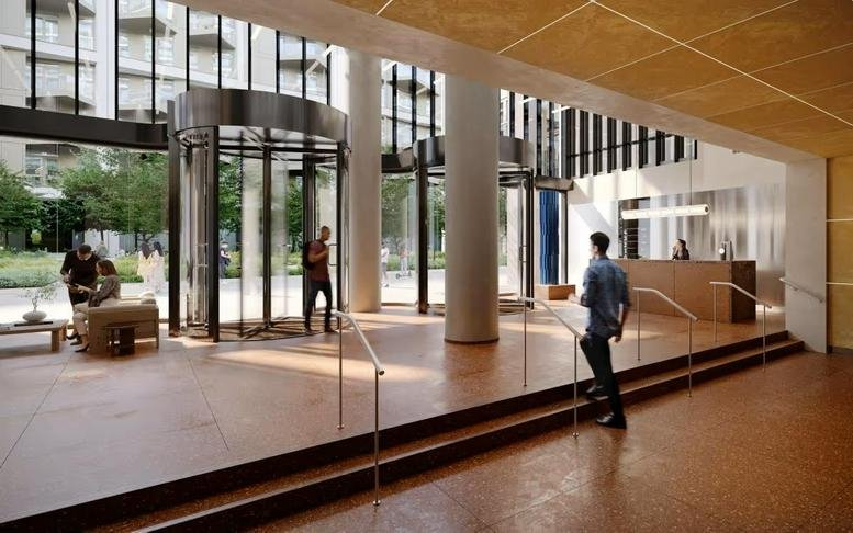 Spacious modern lobby at The Jellicoe with a revolving door entrance and high ceilings.