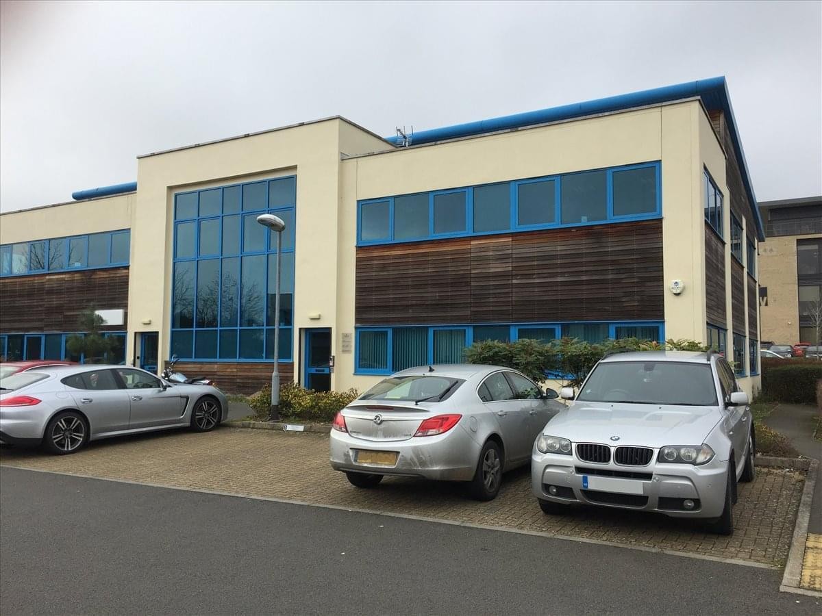 Exterior view of 5 Whittle Court with parking area.