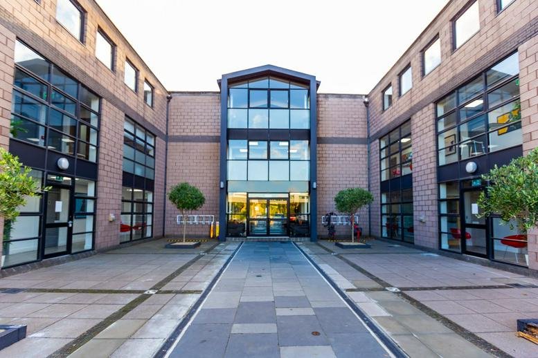Exterior view of the brick and glass facade at 51 Bracken Road, Dublin 18.