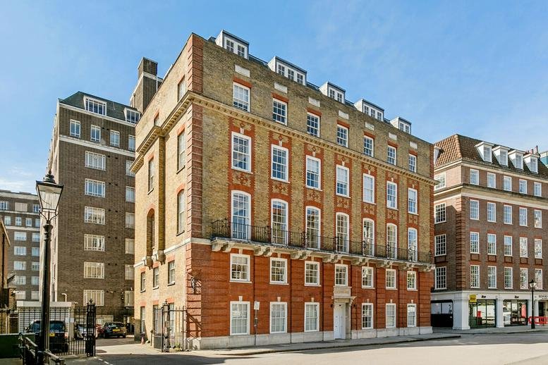 Classic brick facade of Juntos House, 52 Bedford Row featuring large sash windows and white stone accents.