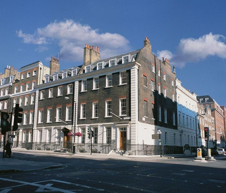 Exterior view of the classic brick and stone building at 53 Davies Street, Mayfair.
