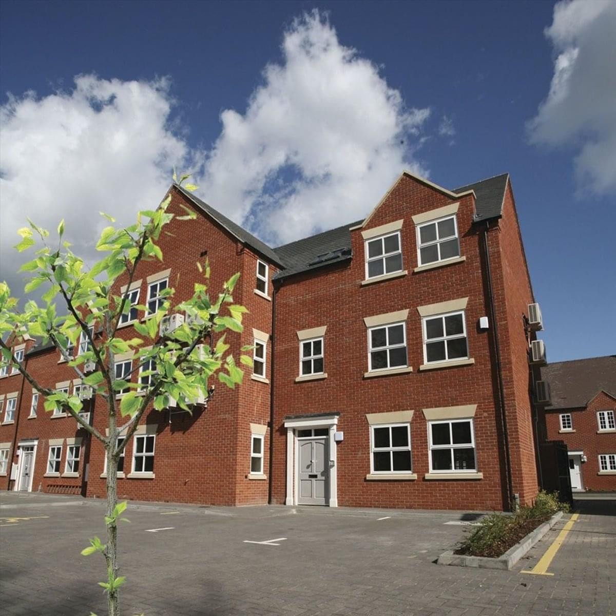 Exterior red brick building at 6 Ardent Court, William James Way with white window frames.