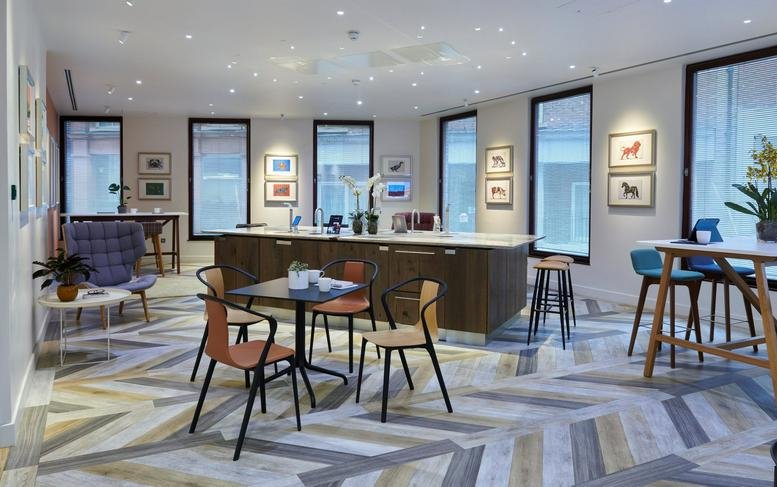 Spacious communal lounge and kitchen area with patterned flooring and ample natural light at 6 Snow Hill.