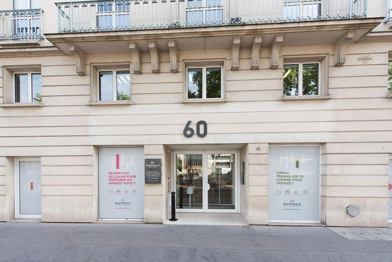 Entrance to 60 Avenue Charles de Gaulle, Neuilly-sur-Seine, Paris Ile de France with large glass doors.