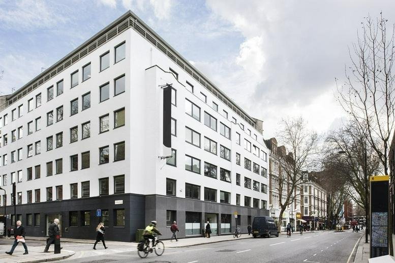 The modern white and grey exterior facade of 60 Gray’s Inn Road, Central London, WC1X.