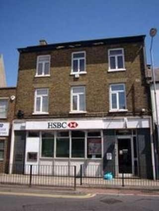 Exterior view of the brick building at 62 High Street (1st floor), March, Cambridgeshire with a ground floor bank.