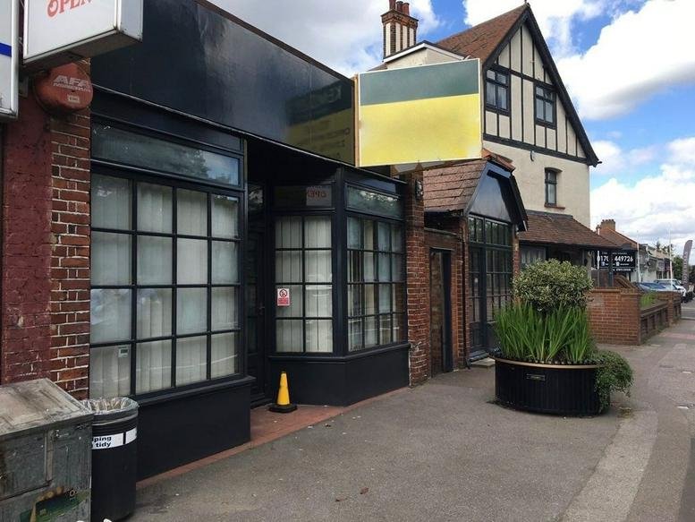 Exterior view of the dark-fronted building at 63-67 Butts Green Road, Hornchurch.