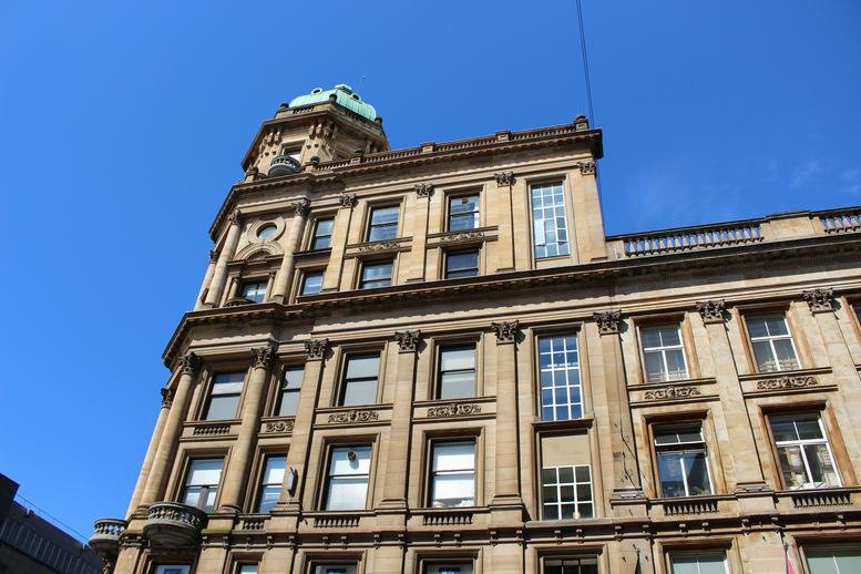 Exterior view of the historic stone facade at 7 Buchanan Street, Glasgow.
