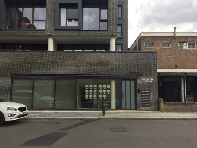 Modern dark brick exterior and street-level entrance of 7 Havelock Place, Harrow.
