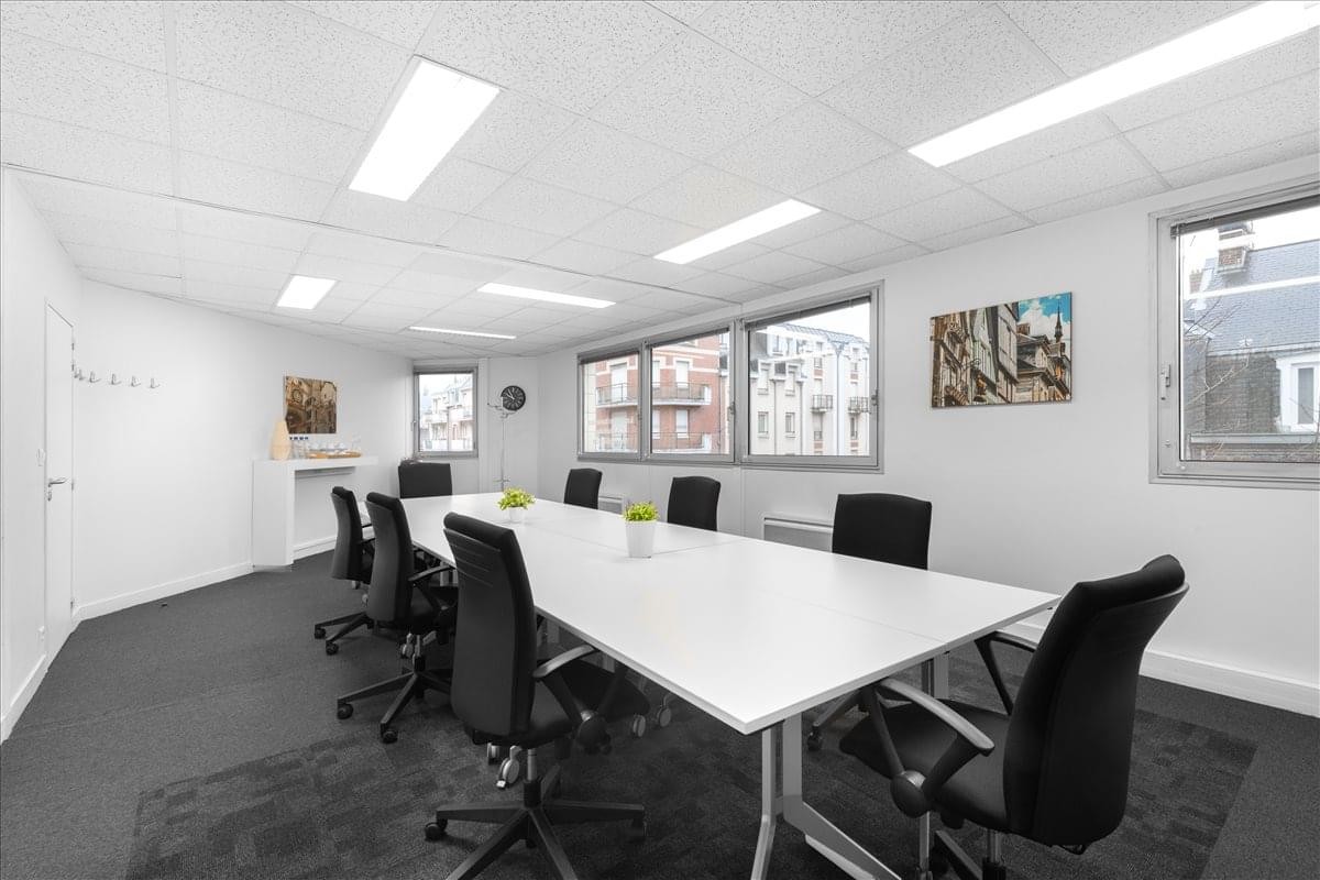 Spacious boardroom at 72 rue de Lessard, Rouen, Picardie, France with a long white table and natural light.