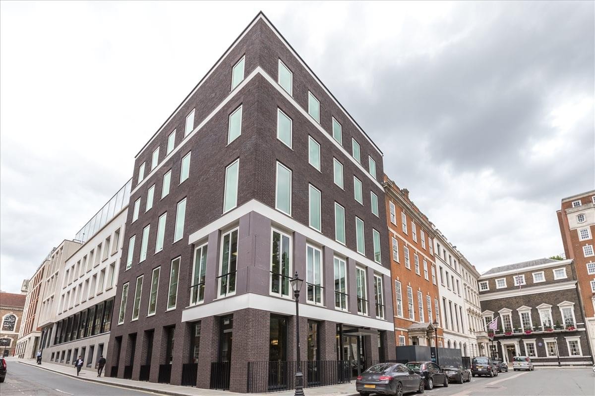 Exterior view of the dark brick corner facade at 8 St. James's Square.