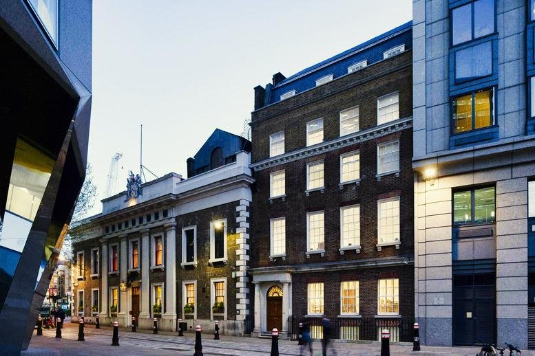 Exterior view of the historic brick and stone facade of 80 Coleman Street, Moorgate, Financial District, London.