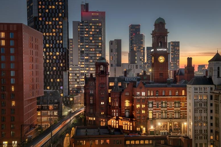 Evening view of the historic brick and modern skyline surrounding SEESAW, 86 Princess Street.