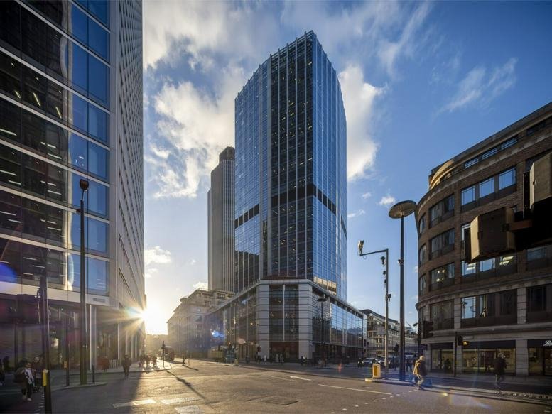 Exterior view of the glass-facade skyscraper at 99 Bishopsgate from the street level.